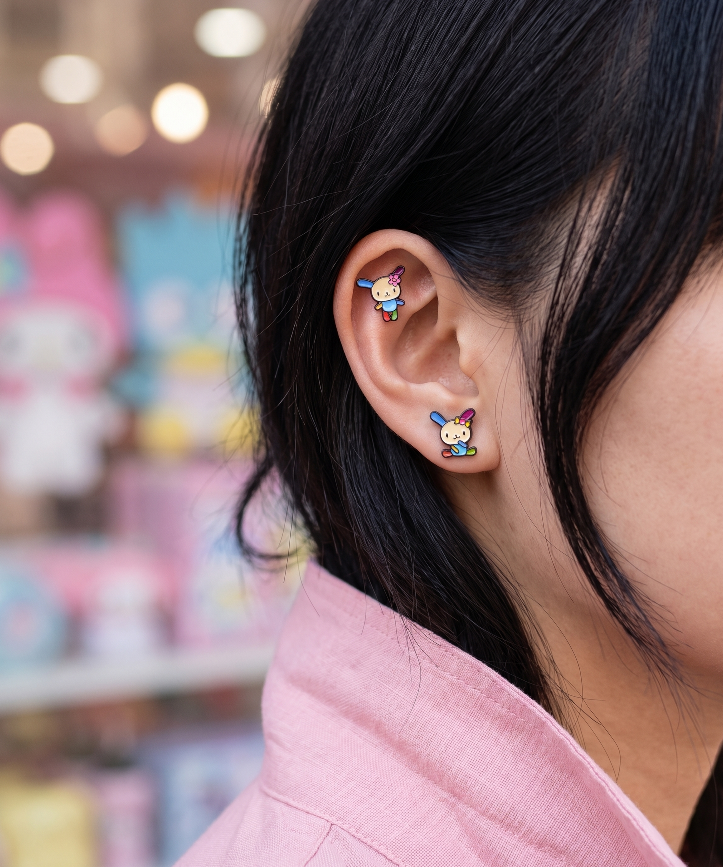 Y2K ear stack inspo — Usahana studs on helix and conch, soft kawaii aesthetic, Sanrio backdrop — 8ttitto8 Seoul