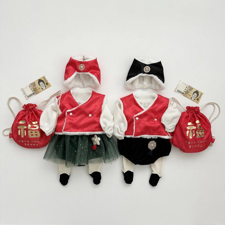 Korean baby New Year hanbok complete sets with red and black jobawi bonnets, vests, norigae ornaments, and lucky pouches.