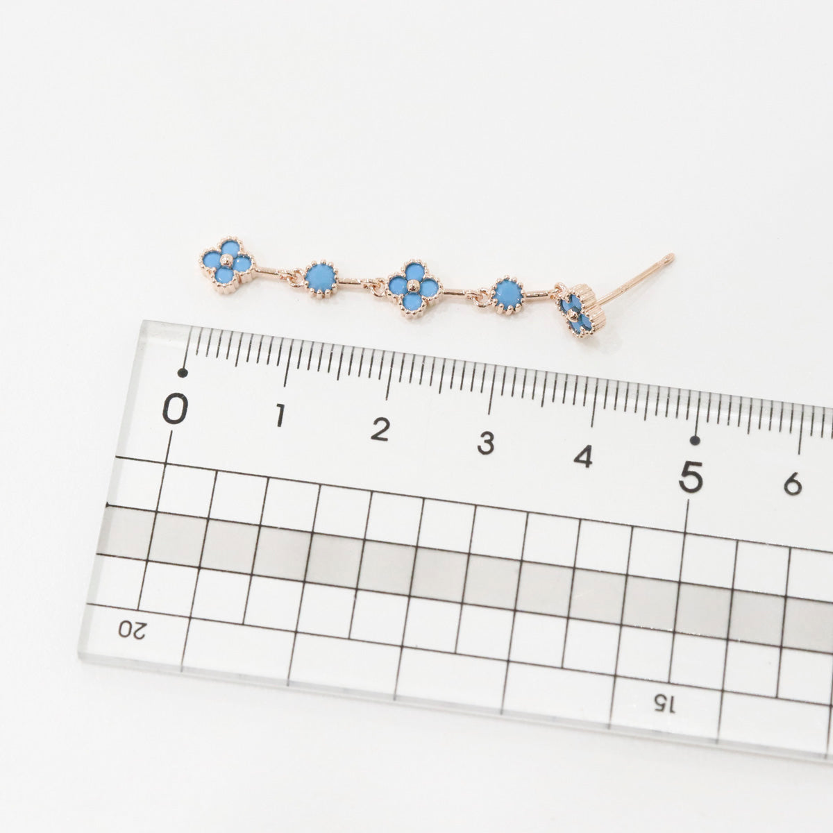Turquoise blue clover earrings with ruler showing 4.8cm total length measurement