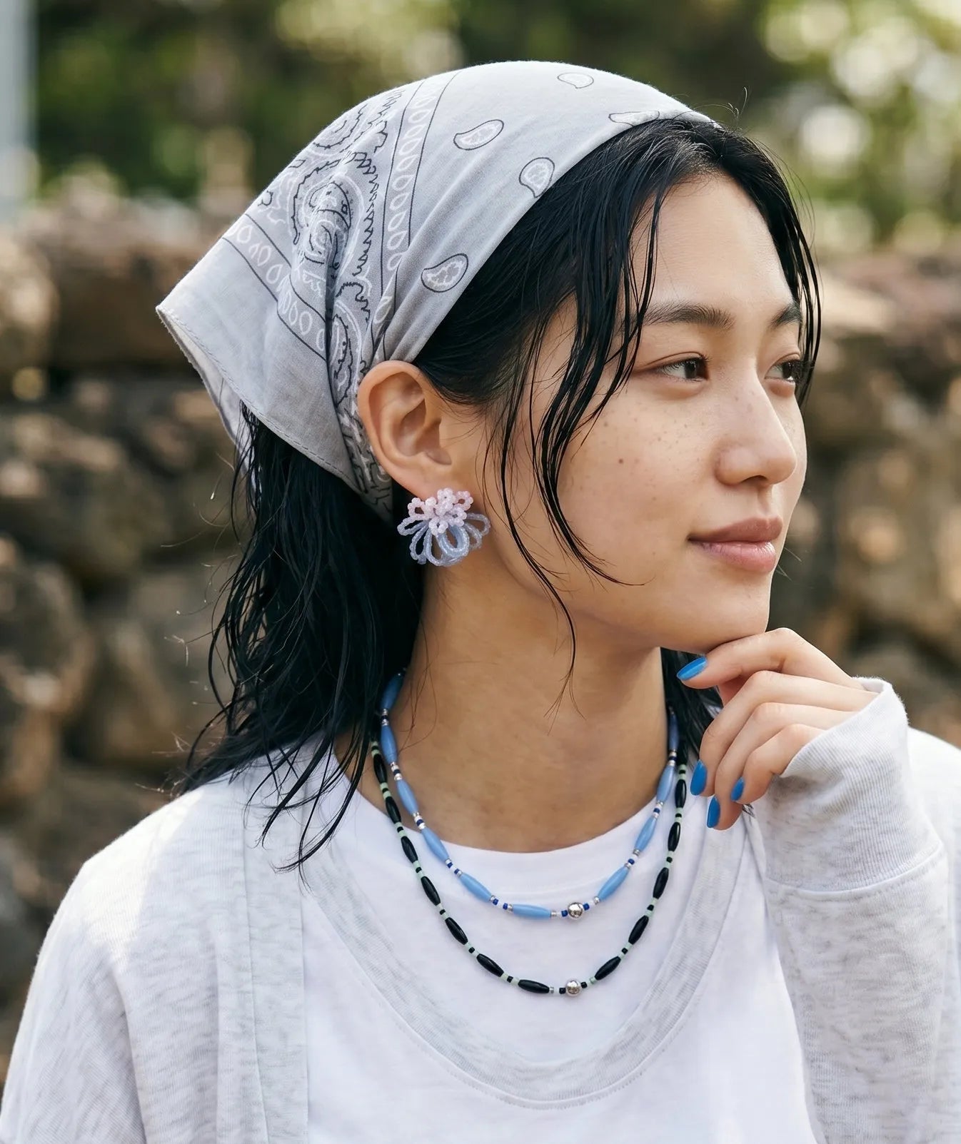 Vacation bandana outfit inspo, blue and black beaded necklace stack, boho bandana styling.