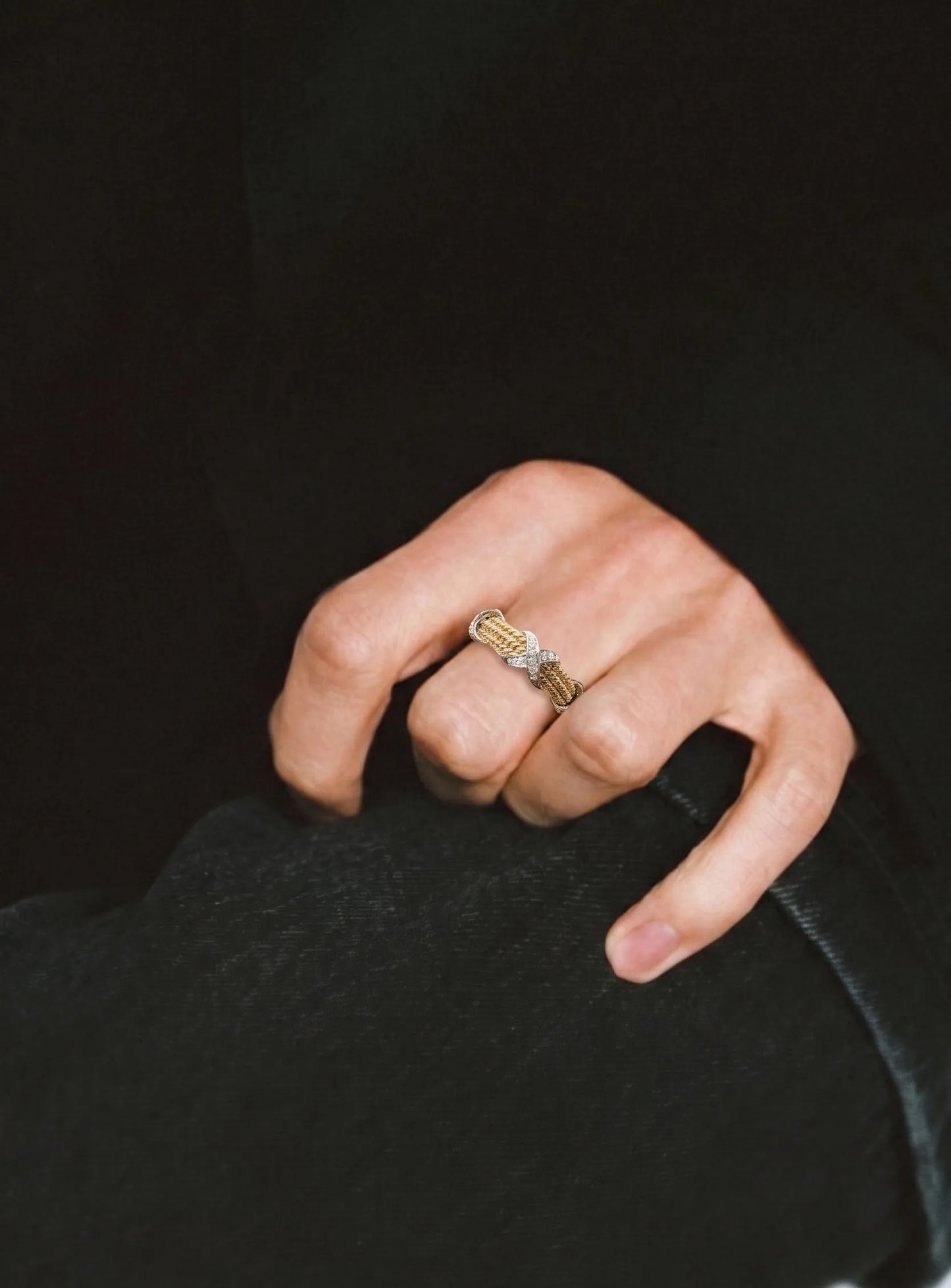 Close-up mismatch ring look, two-tone cubic X band, tarnish-free daily essential.