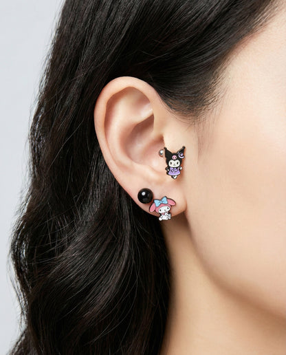  Kuromi witch and My Melody earrings on ear with black ball stud showing mixed character styling