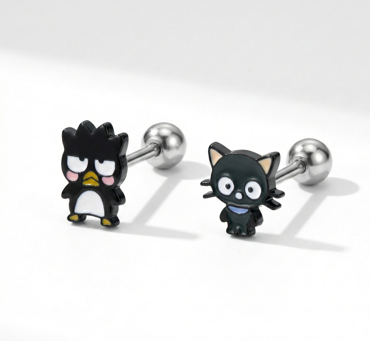  Badtz-Maru and Chococat character piercing studs with surgical steel posts on white background