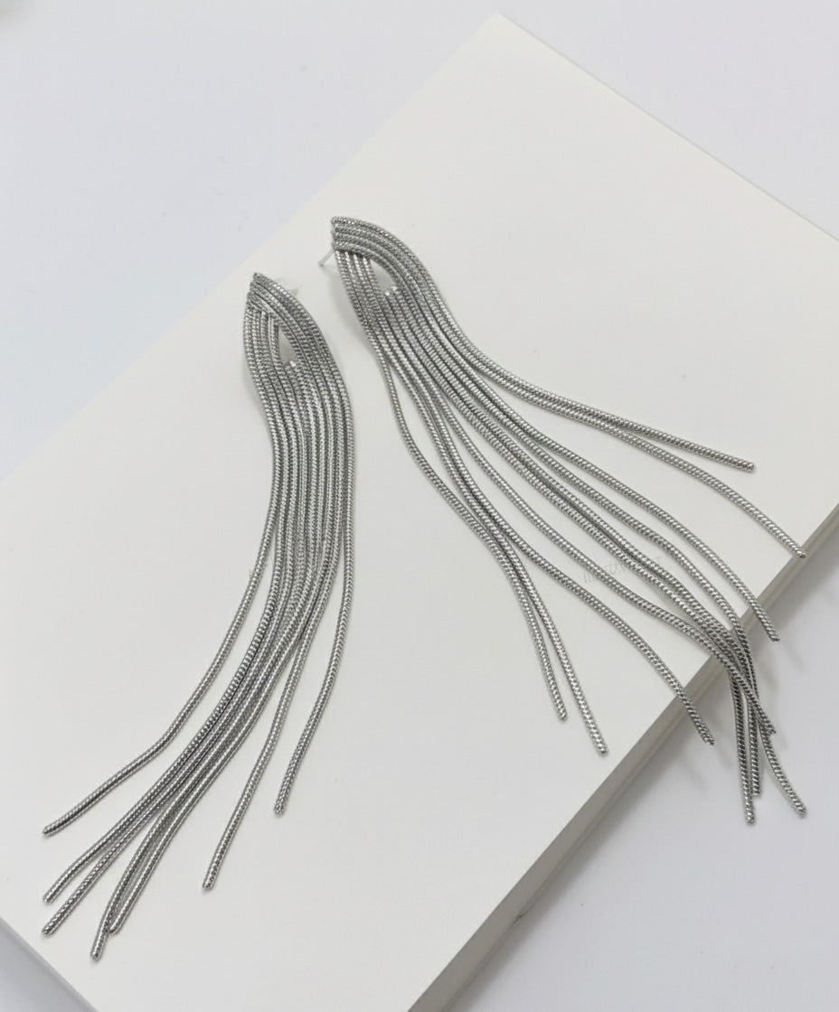 Close-up of silver chain fringe tassel earrings displaying waterfall cascade effect, 10cm length