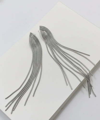 Close-up of silver chain fringe tassel earrings displaying waterfall cascade effect, 10cm length