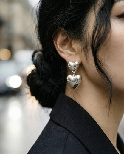Silver heart drop earrings paired with black blazer - urban street style