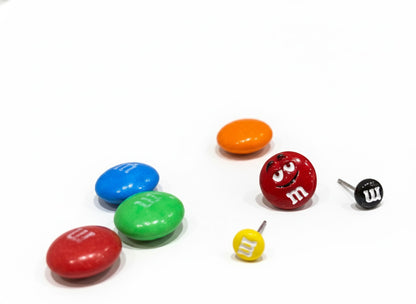 M&M's inspired earring collection on white background featuring multicolor candy studs in red, blue, green, orange with character designs, two-size set including large and mini pieces, 925 sterling silver posts, Korean handmade jewelry