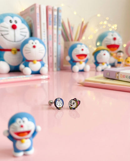 Doraemon Dorami piercings displayed with anime collectibles