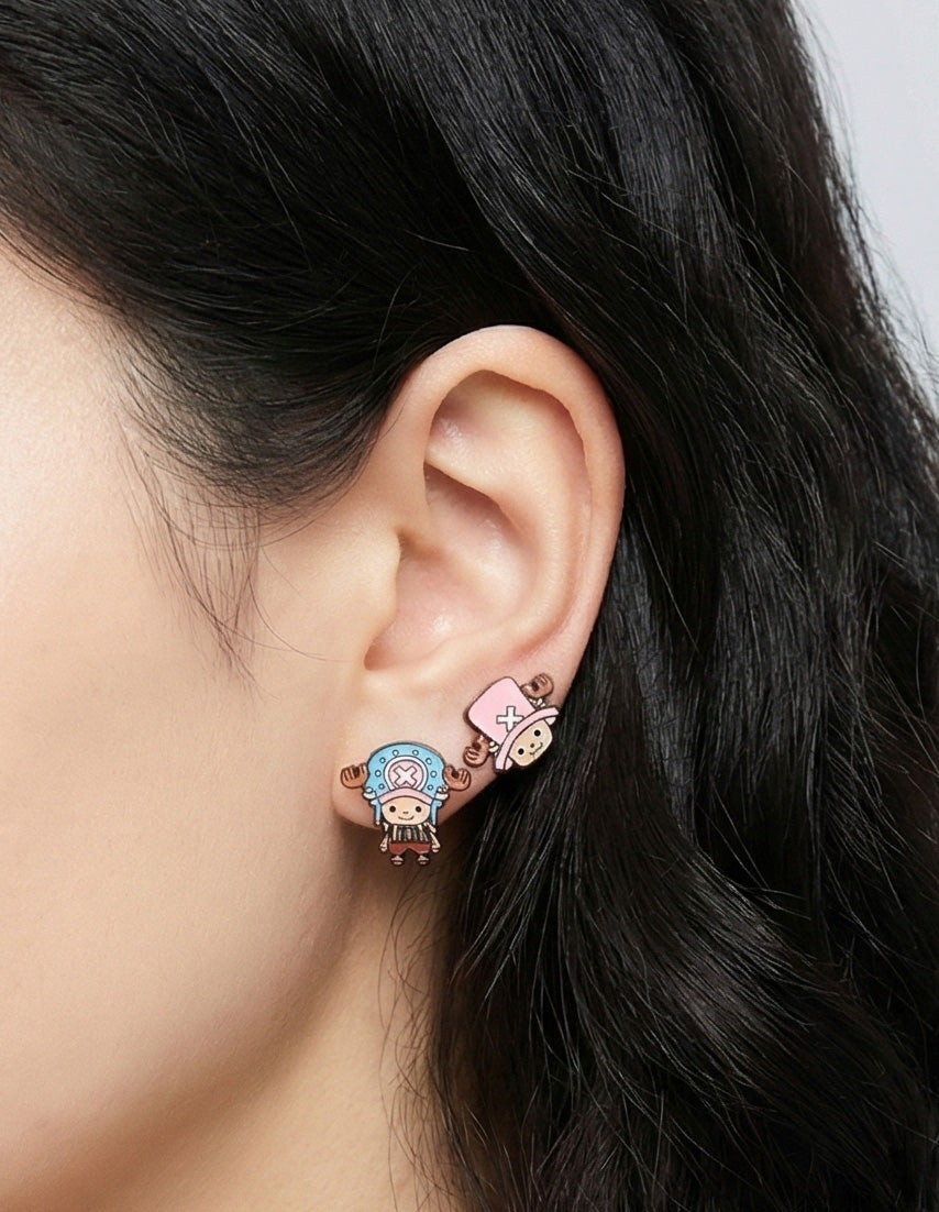 Model wearing complete Chopper earring set with both pink and blue earrings on both ears asymmetrical style