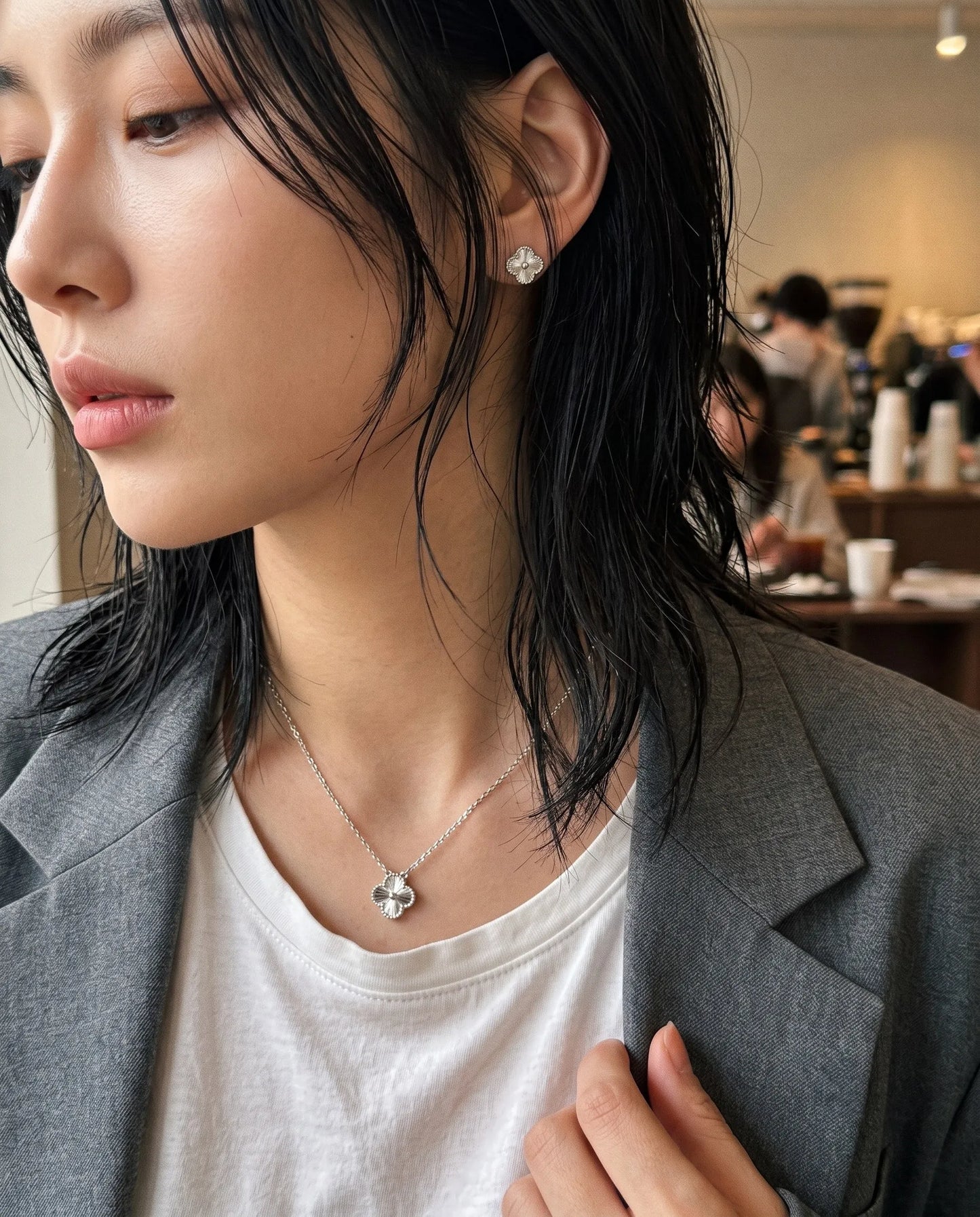 Coquette-coded milgrain clover necklace and stud earring set 925 sterling silver platinum plated, gray blazer white tee K-style curated necklace earring look.