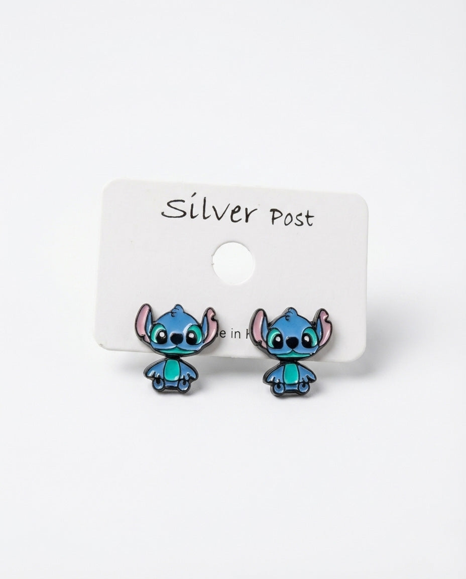 Blue alien character stud earrings on white silver post card, Made in Korea enamel jewelry
