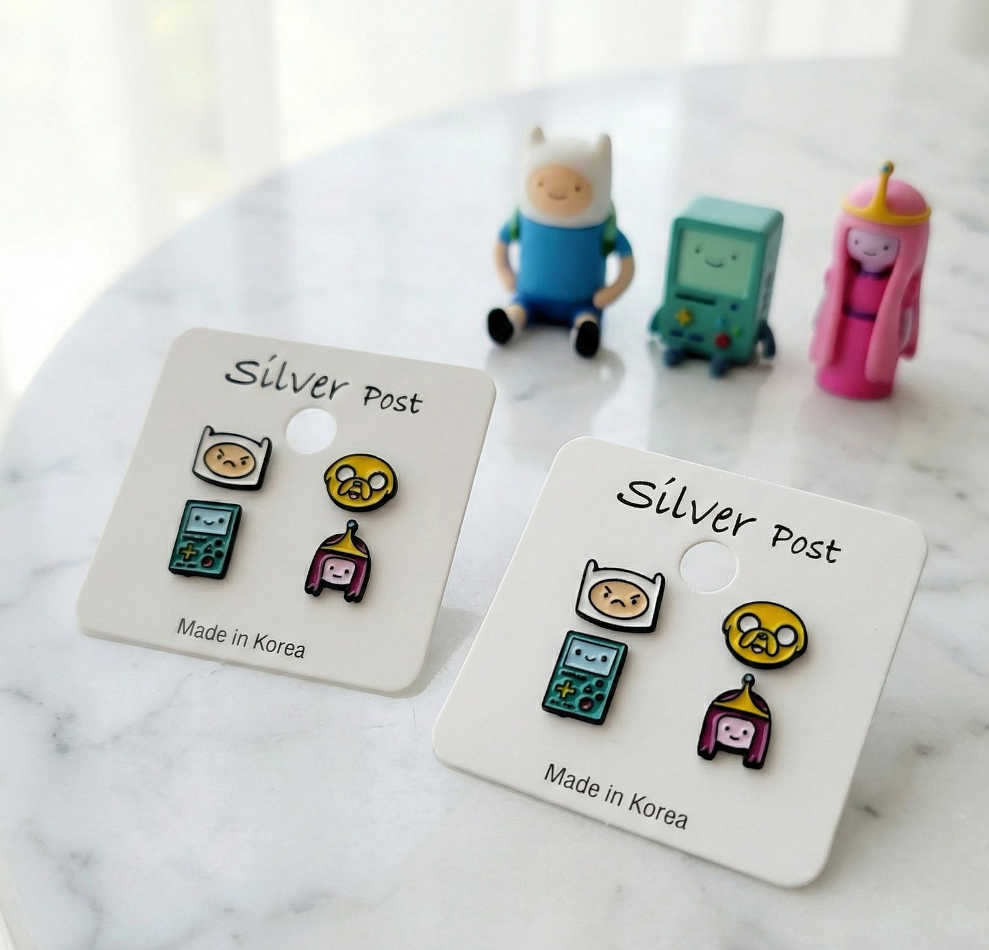 Adventure Time character earrings Finn angry Jake BMO Princess Bubblegum on white cards with all character figurines