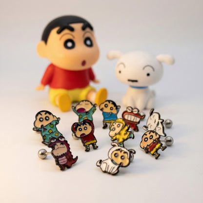 Complete set of 12 Shin-chan anime character earrings displayed with collectible figures