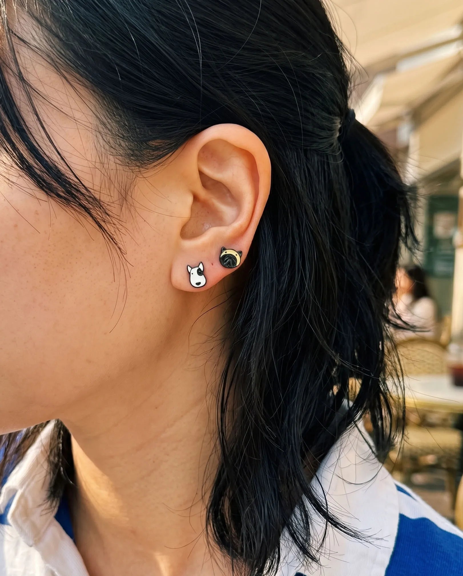 Bull terrier and French bulldog enamel mismatch studs on ear — curated ear dog jewelry, K-style kidult earrings, handmade enamel