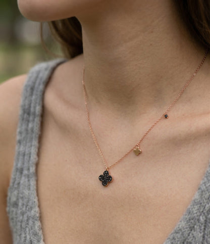 925 silver cognac clover necklace styled with grey knit top – rose gold plated chain and mini charm detail on neckline