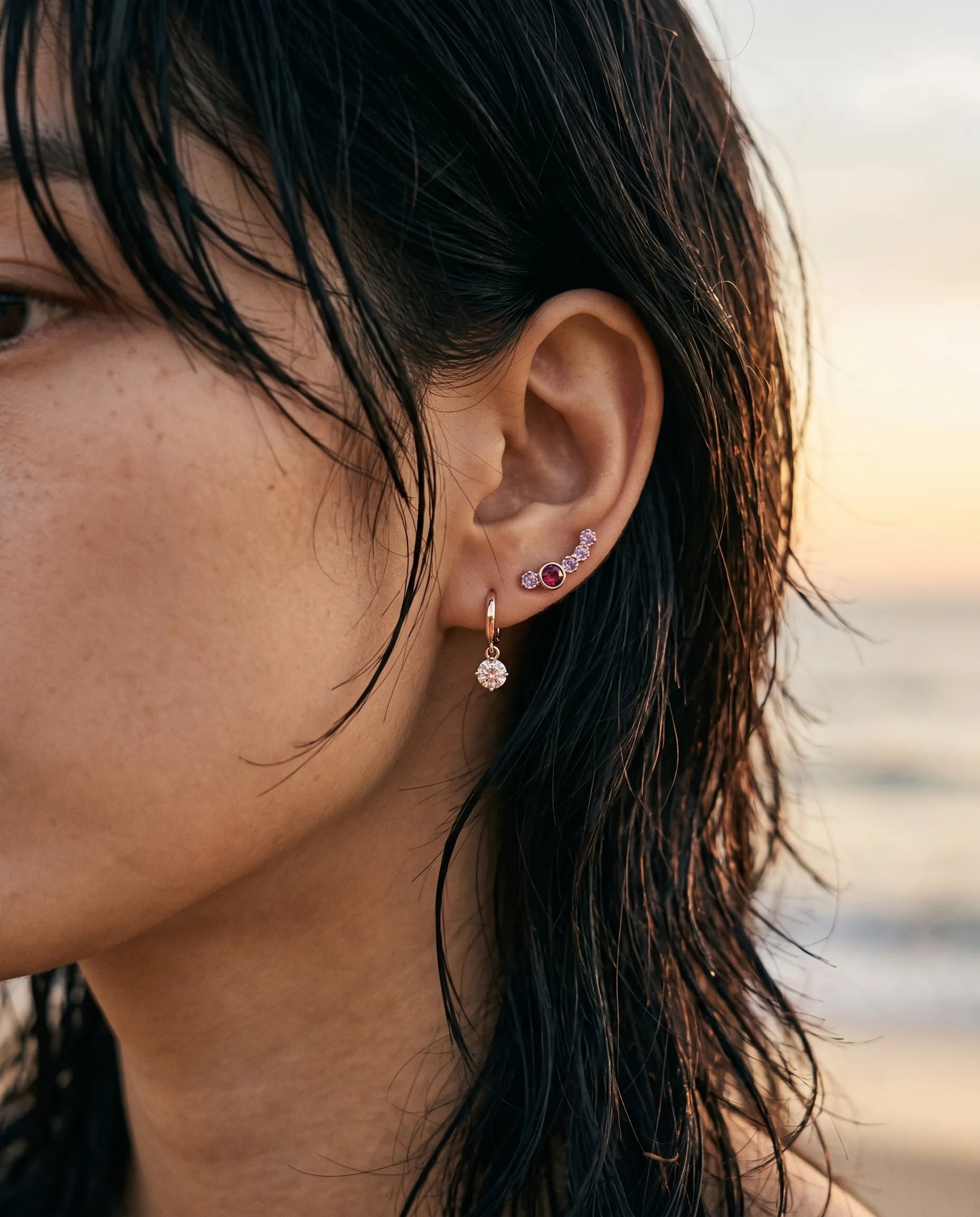 925 silver rose gold bezel gemstone ear climber with CZ charm drop earring – mismatched K-style ear stack at sunset beach

