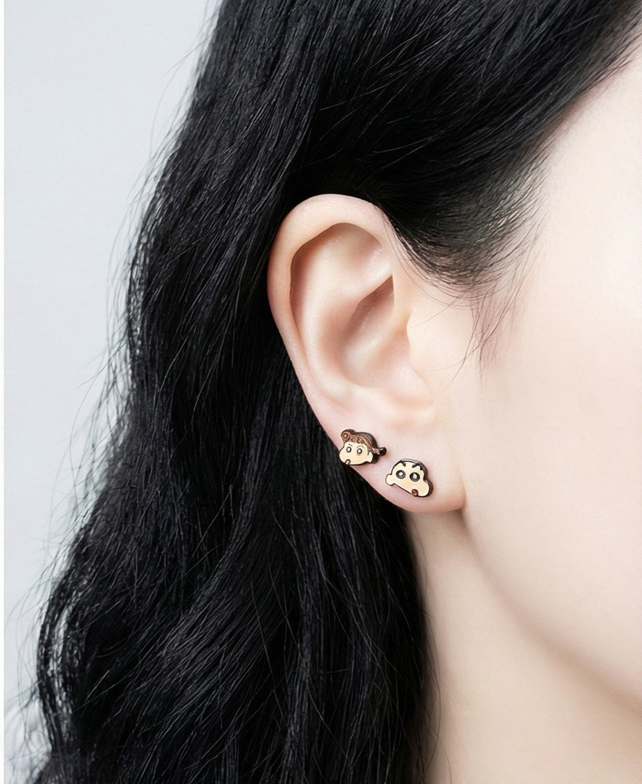 Crayon Shin-chan Himawari and Shin-chan earrings worn together on lobe, handmade silver post studs
