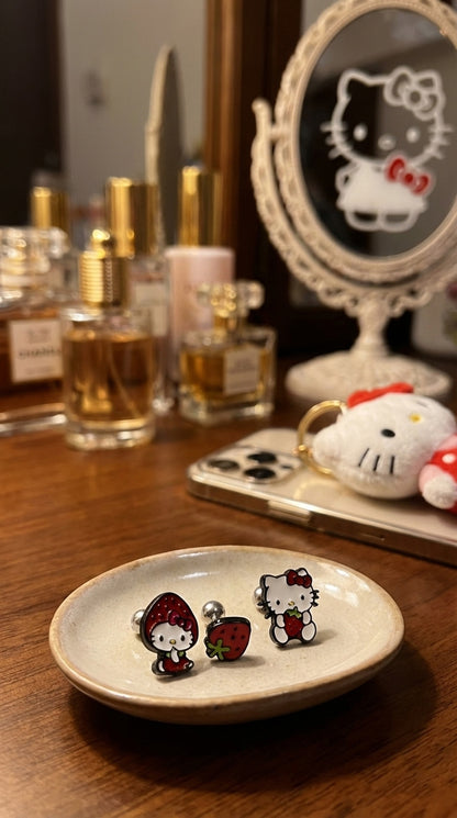 Kawaii Hello Kitty strawberry piercings on vanity tray with mirror Sanrio jewelry