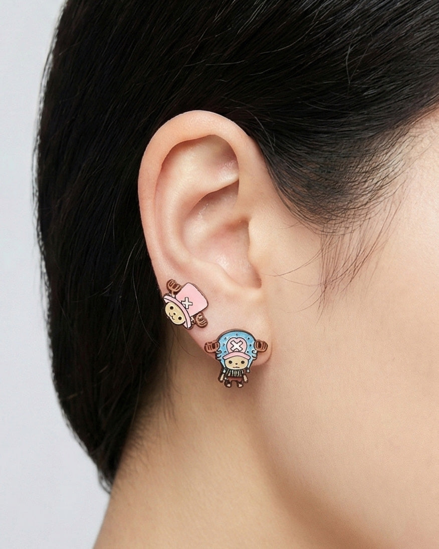 Close-up of model wearing pink Chopper earring from set on single ear front view