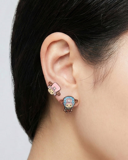 Close-up of model wearing pink Chopper earring from set on single ear front view