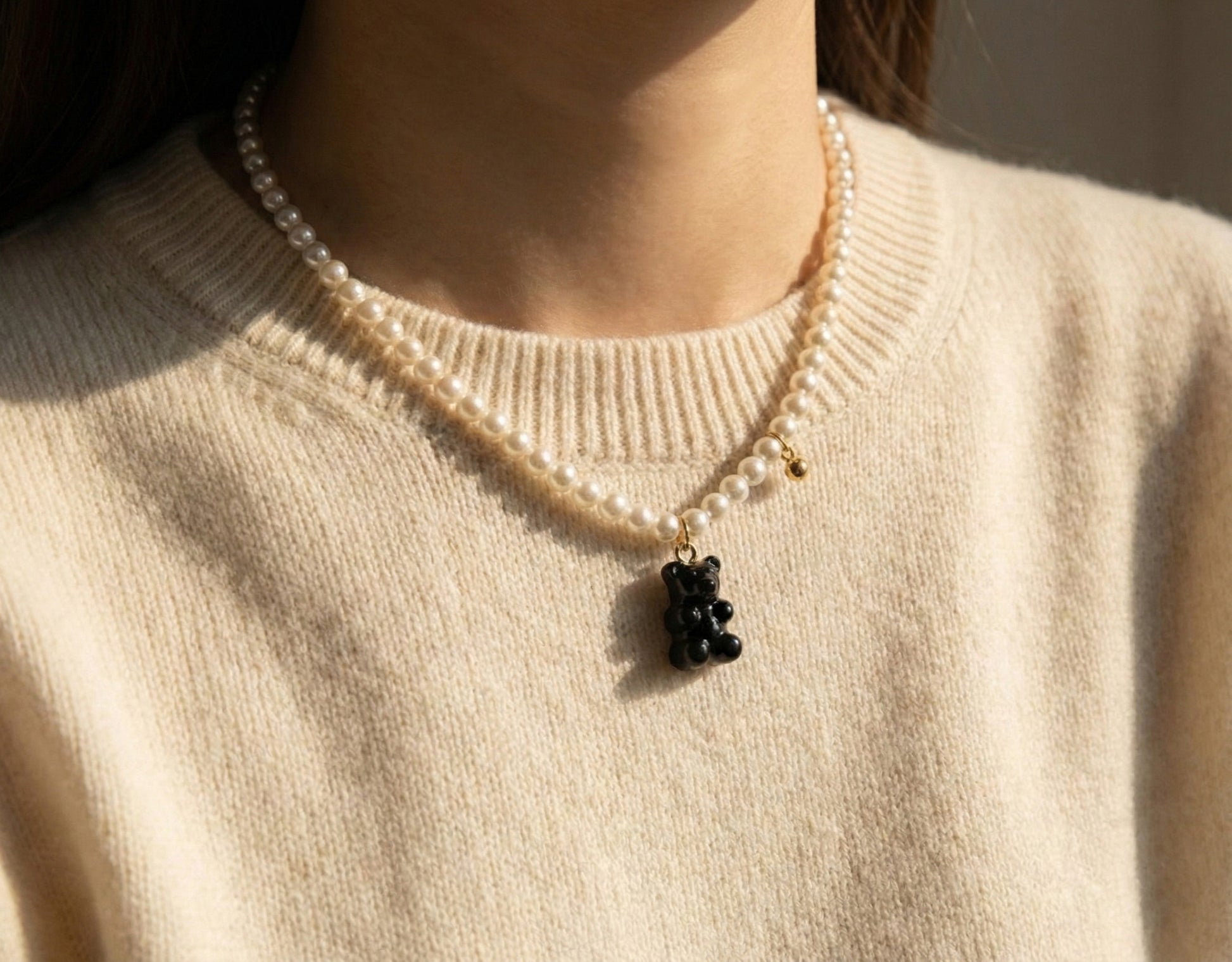 Cream sweater with black gummy bear pearl necklace - cozy aesthetic