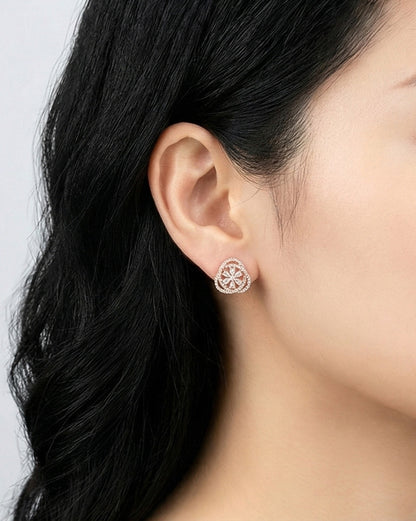 Woman wearing rose gold heart cubic zirconia earring on lobe showing elegant sparkle, 925 silver hypoallergenic posts, Korean romantic jewelry