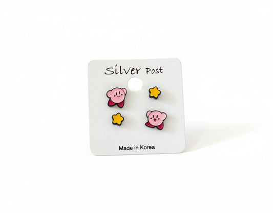  Close-up of Kirby character earrings and star studs on white background