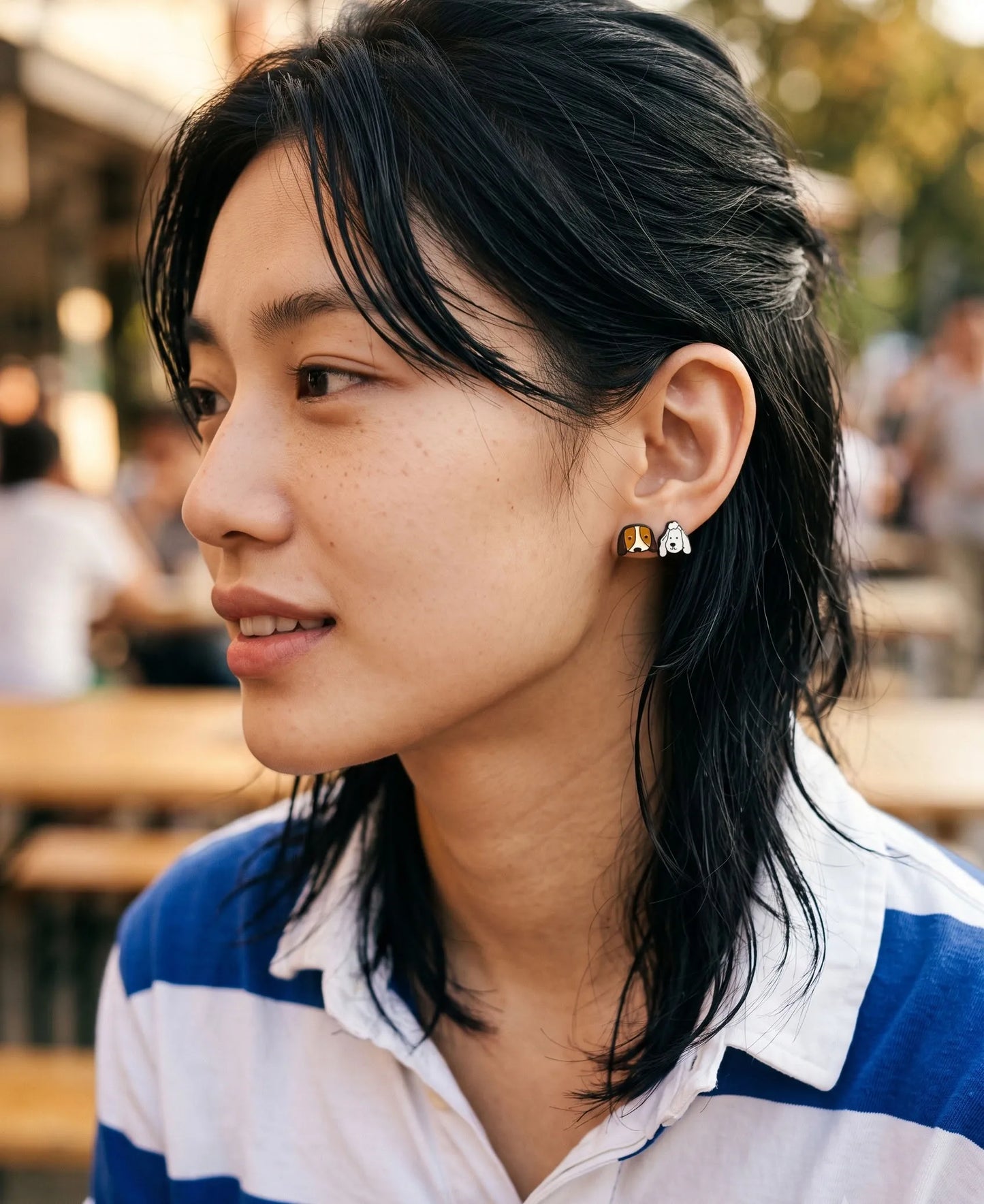 Beagle and poodle enamel stud earrings close-up on ear — dog mom earrings, mismatch lobe studs, hypoallergenic surgical steel post