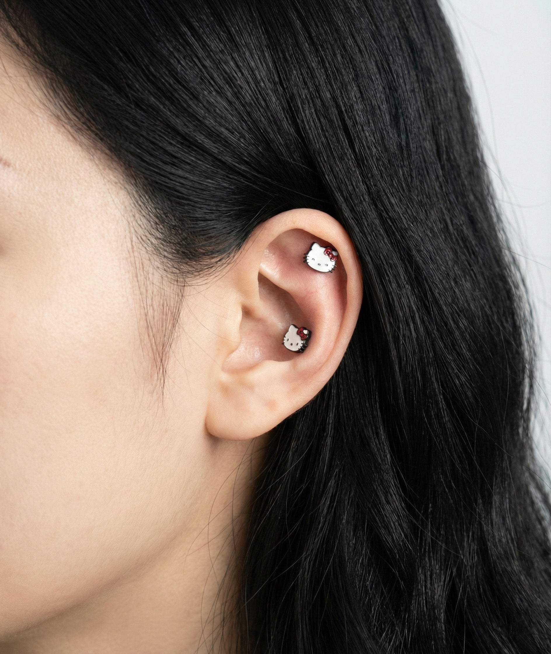 Sanrio Hello Kitty helix piercing tragus cartilage stud earrings on ear