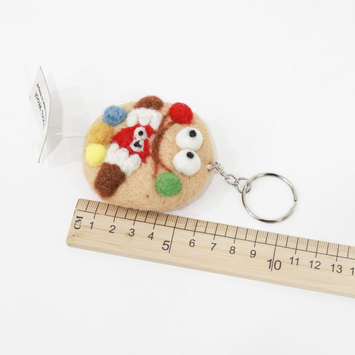 Cookie monster wool felt keychain with ruler showing size approximately 5cm, product measurement