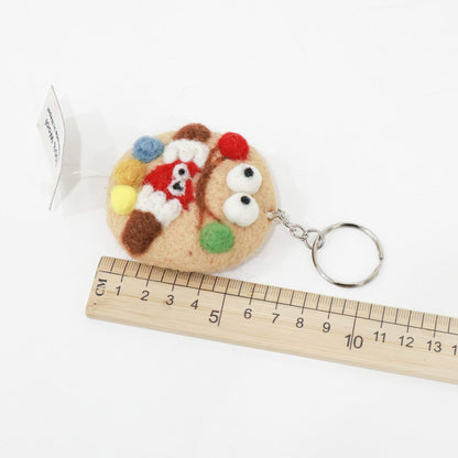 Cookie monster wool felt keychain with ruler showing size approximately 5cm, product measurement