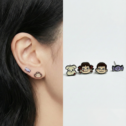 Four-piece Peko Chan character stud earring set on white card showing Peko, Poko, puppy and candy designs with silver post labeling and Made in Korea stamp