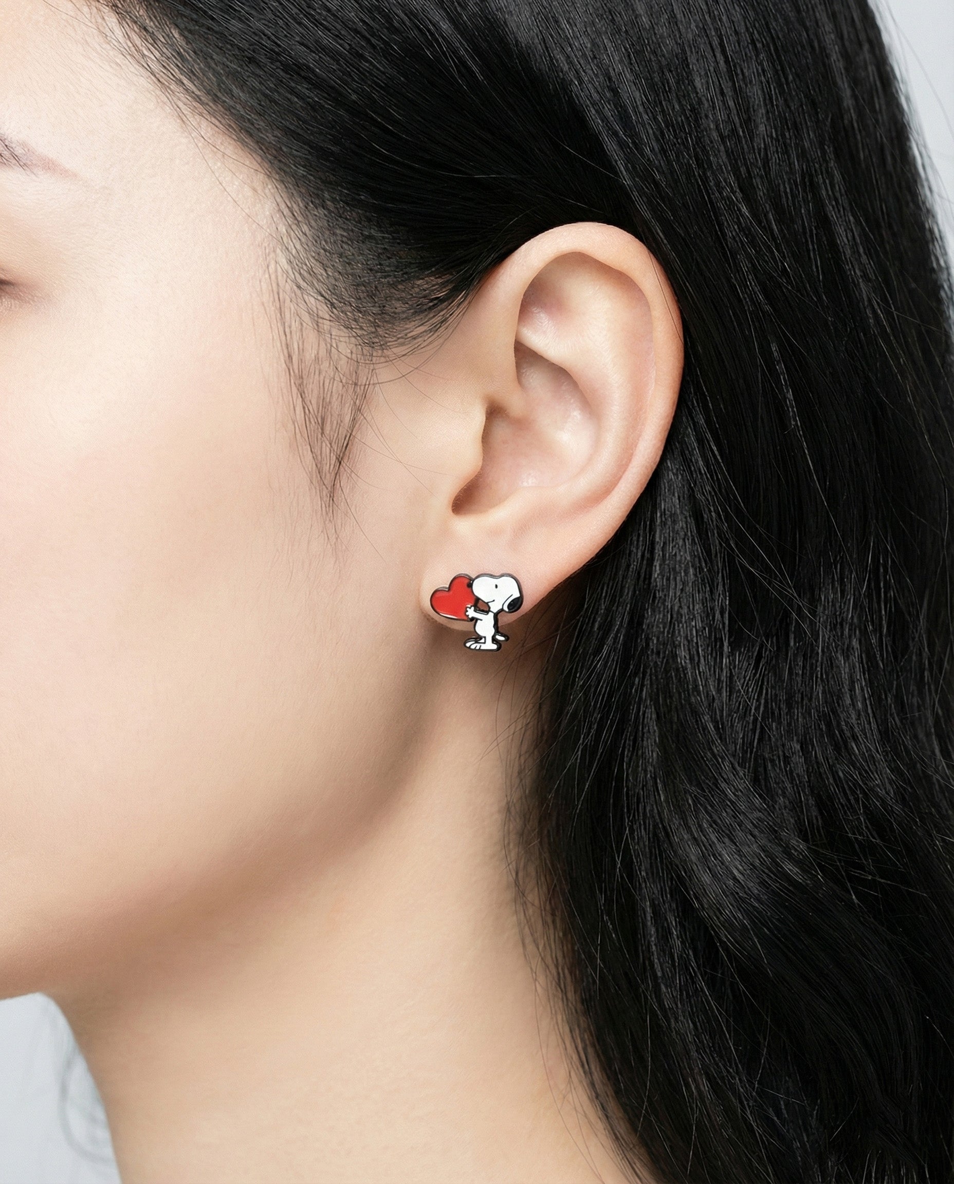 Snoopy with red heart asymmetric earring on model ear