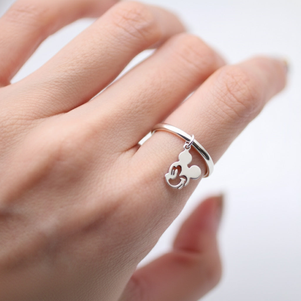 Close-up of 925 silver mouse charm dangle ring showing thick band and iconic character silhouette
