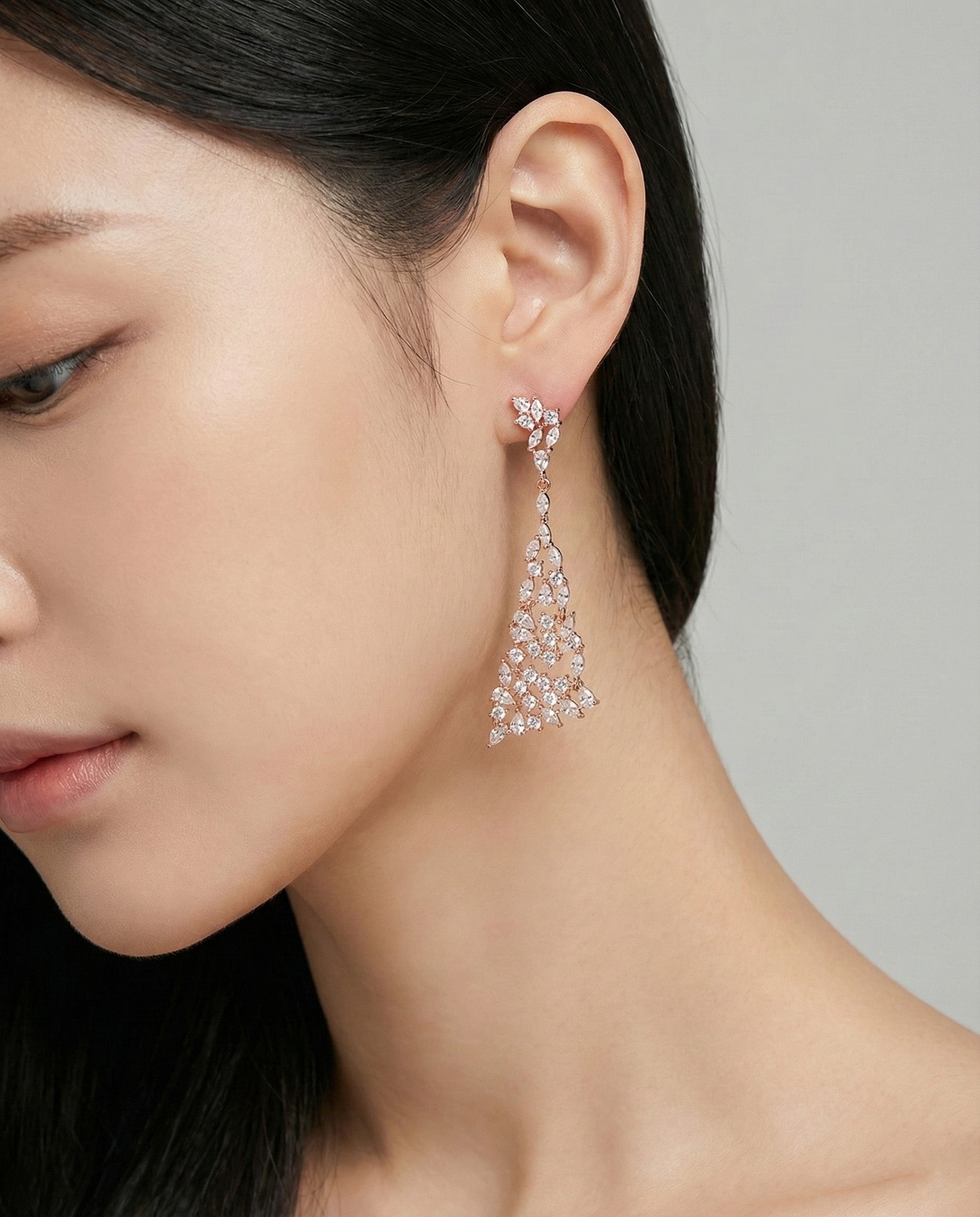 Rose gold marquise cubic zirconia chandelier drop earrings worn on model