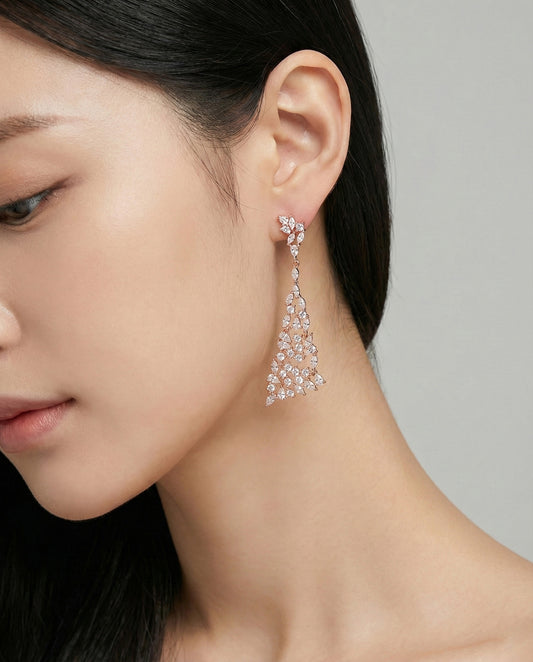 Rose gold marquise cubic zirconia chandelier drop earrings worn on model