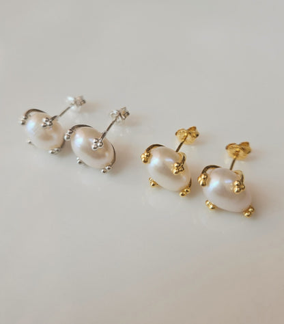 Gold and silver pearl stud earrings displayed on a clean white background.