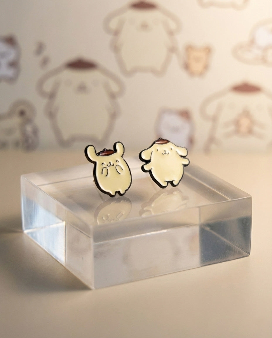 Handmade Pompompurin asymmetric enamel earrings on clear display stand
