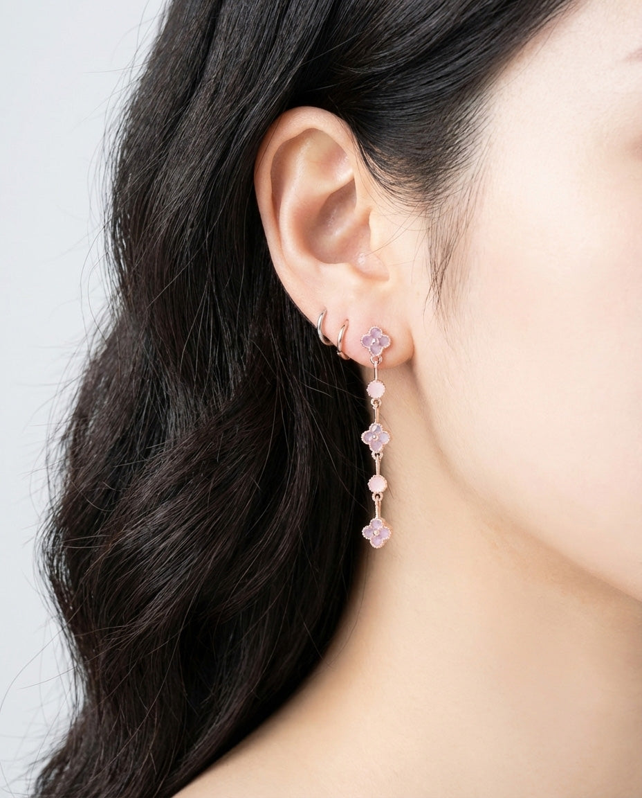 Clover drop earrings in pink cubic zirconia worn on model showing length and delicate movement