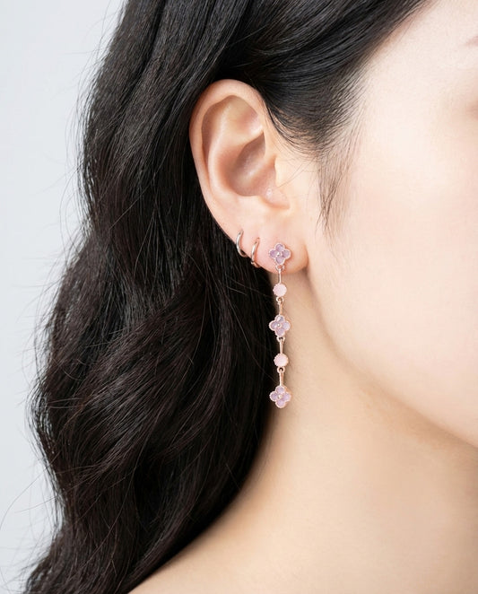 Clover drop earrings in pink cubic zirconia worn on model showing length and delicate movement