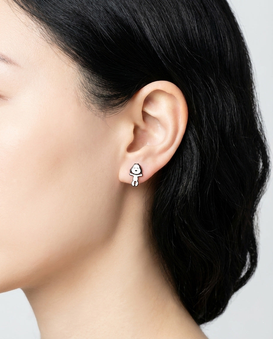 Snoopy character stud earring on model ear front view