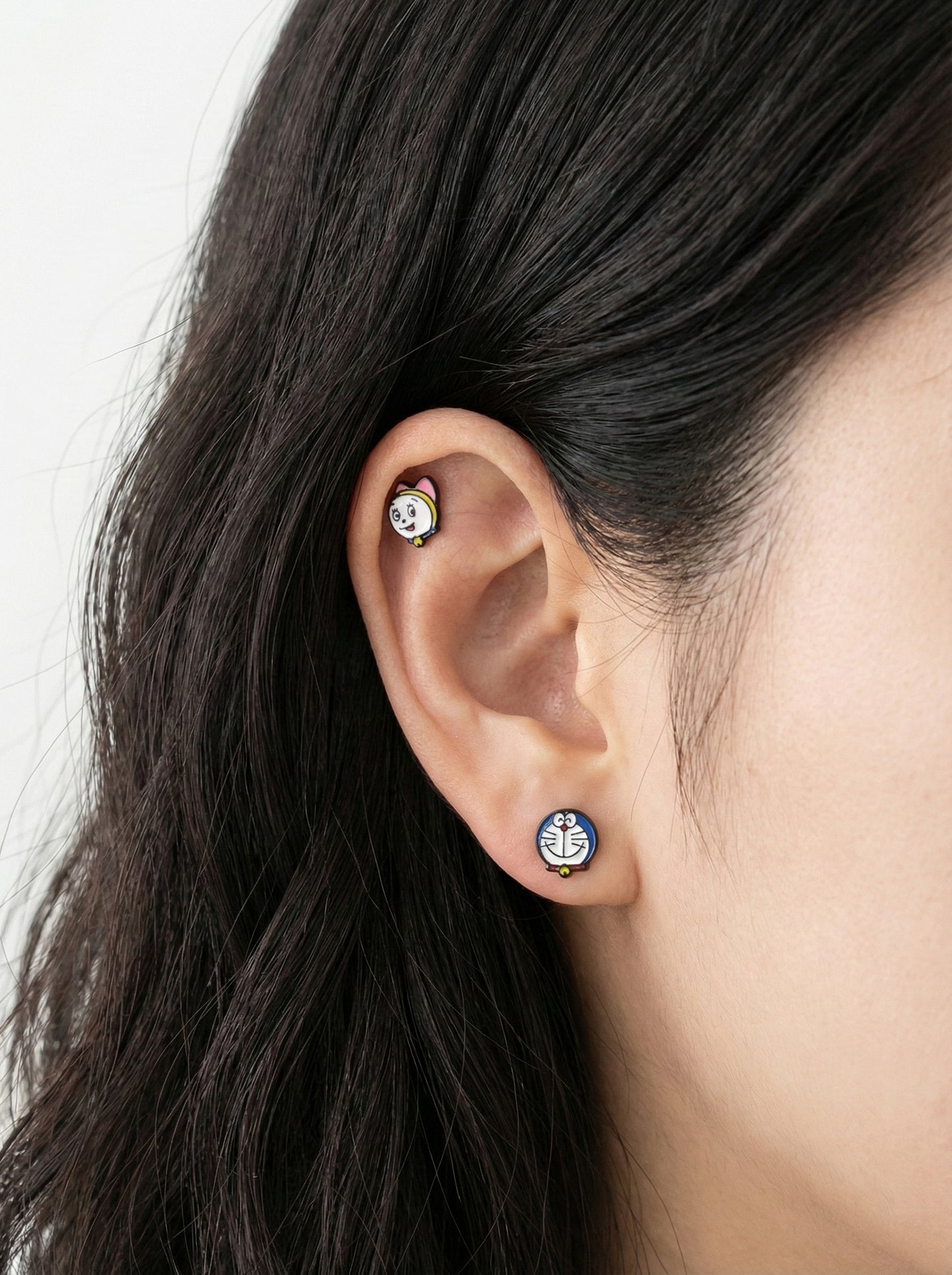 Doraemon and Dorami surgical steel piercings worn on lobe and helix