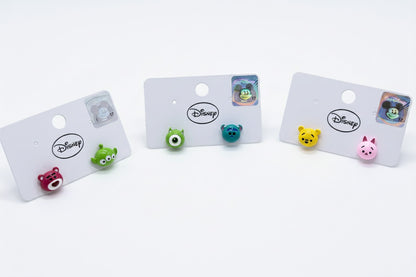 Three Disney Tsum Tsum character earring sets display - Pooh Piglet Lotso Alien Mike Sulley on acrylic stand