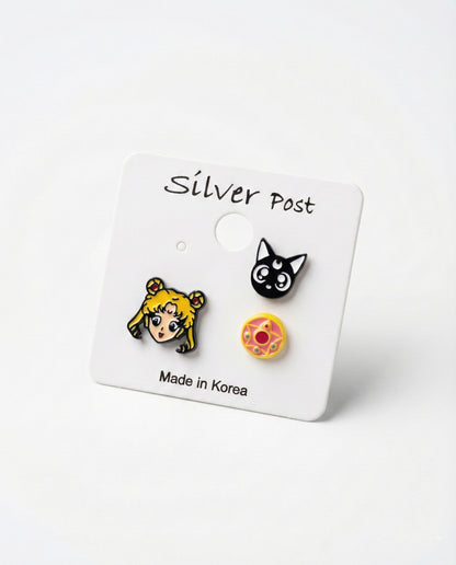 Sailor Moon Luna and Crystal Star Compact 3-piece enamel earring set on white card with Made in Korea label