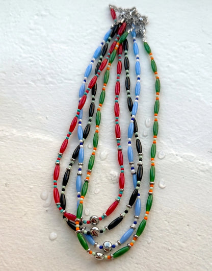 Vivid beaded necklace collection in red, blue, green, black, sold individually, surgical steel.