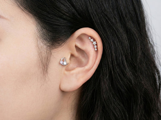 Celestial moon and rabbit cartilage piercing worn in conch and helix with CZ line accent earrings
