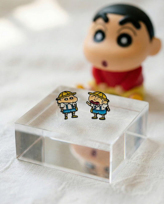 Crayon Shin-chan and Max character enamel stud earrings on display with Shin-chan figurine background