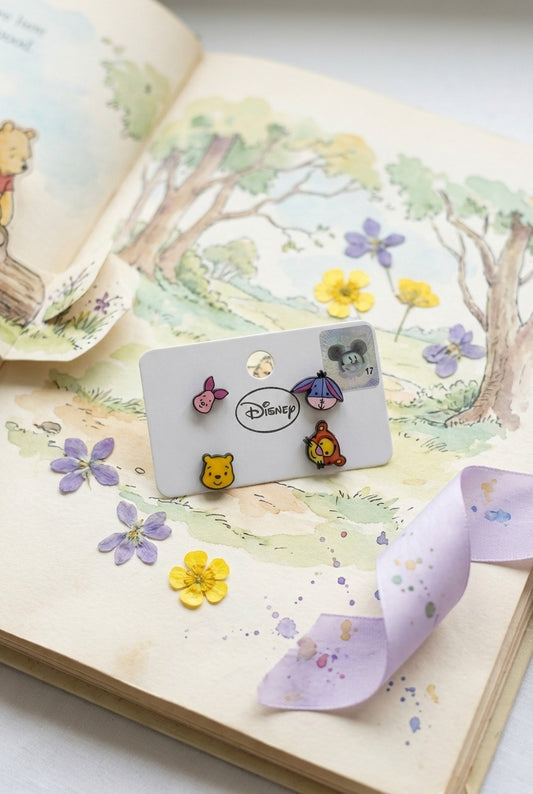 Disney Winnie the Pooh earring set on vintage storybook background with pressed flowers