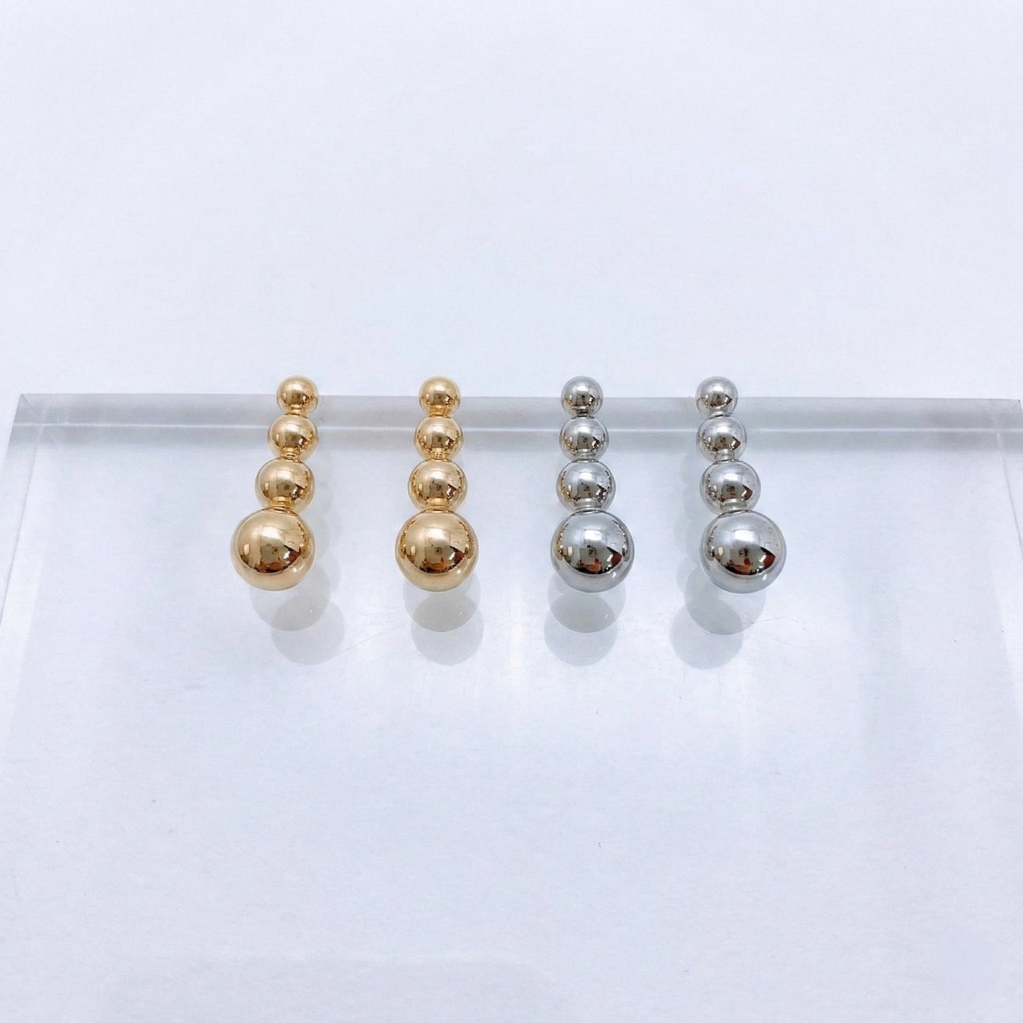 Blank product background for 4-tier graduated sphere bar earrings