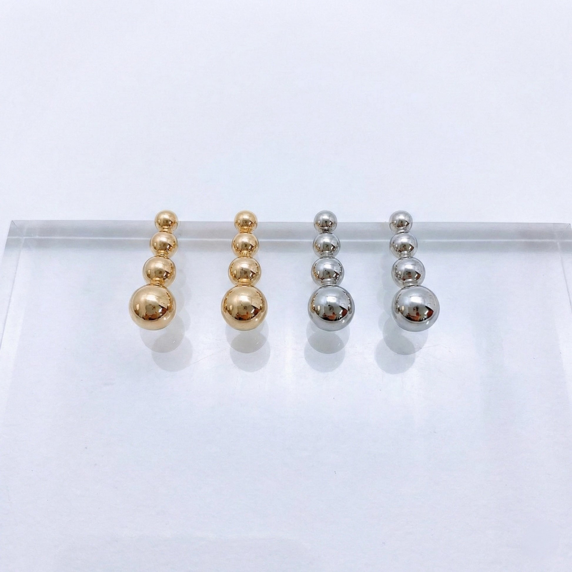 Blank product background for 4-tier graduated sphere bar earrings